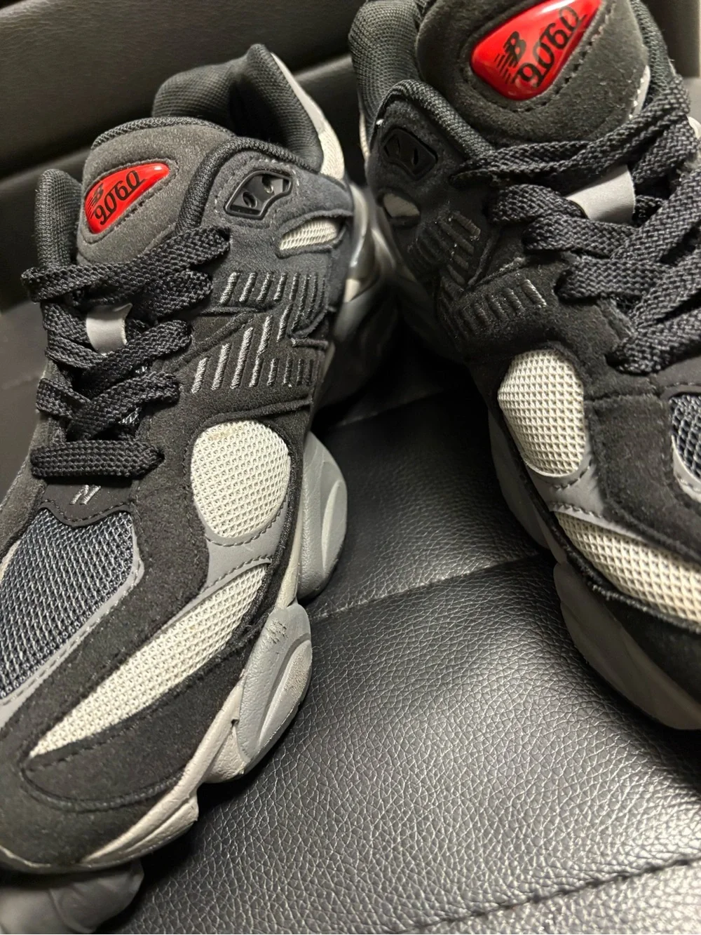 New Balance Kids Black and Gray Athletic Sneakers with Red Logo Accent
